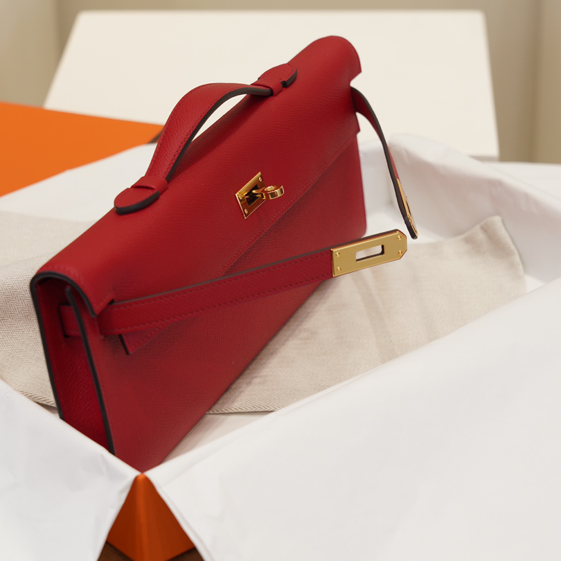 Red Textured Leather Evening Clutch With Gold-Tone Turn Lock and Sleek Structured Silhouette