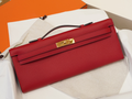 Red Textured Leather Evening Clutch With Gold-Tone Turn Lock and Sleek Structured Silhouette