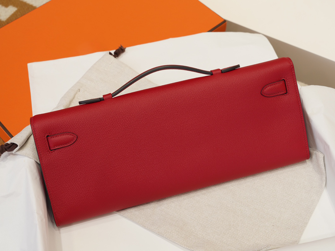 Red Textured Leather Evening Clutch With Gold-Tone Turn Lock and Sleek Structured Silhouette