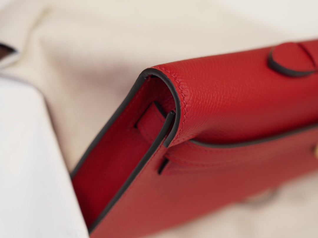 Red Textured Leather Evening Clutch With Gold-Tone Turn Lock and Sleek Structured Silhouette