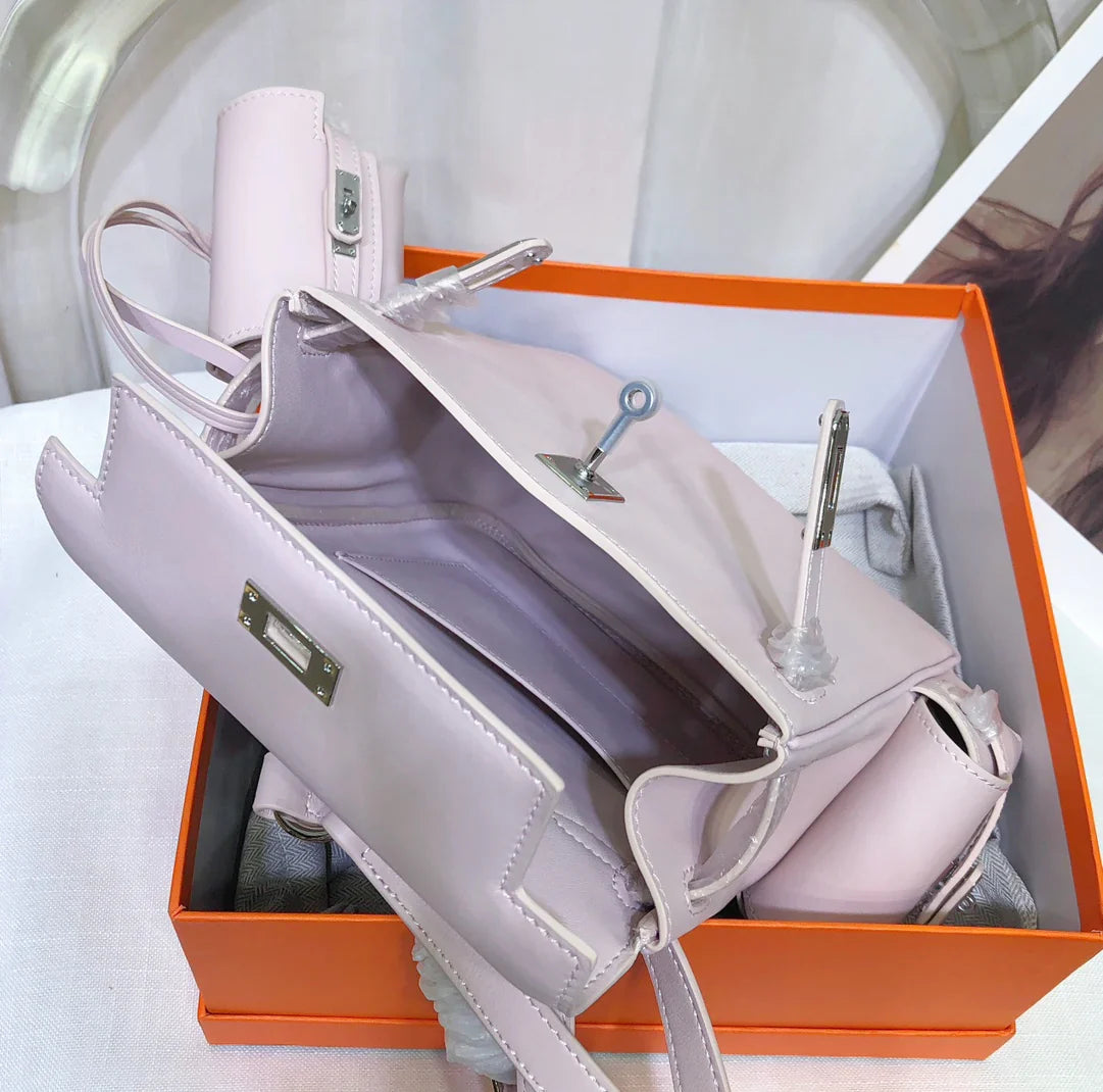 Pale Mauve Pink Mini Flip Backpack With Silver Turn Lock and Adjustable Shoulder Straps